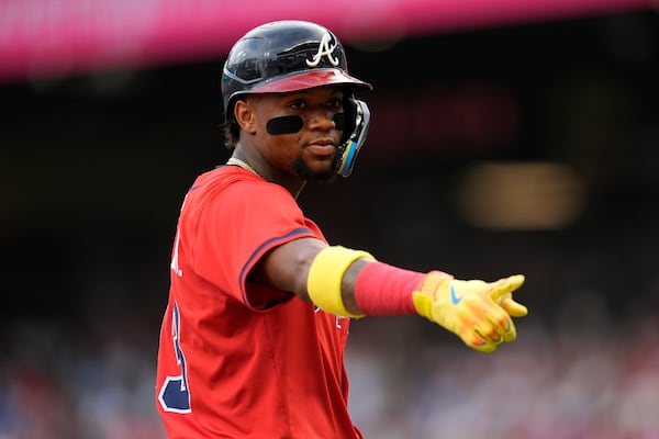 Atlanta Braves outfielder Ronald Acuña Jr. (13) speaks to the Colorado Rockies bench in the first inning of a baseball game, Friday, June 13, 2025, in Atlanta. (AP Photo/Mike Stewart)