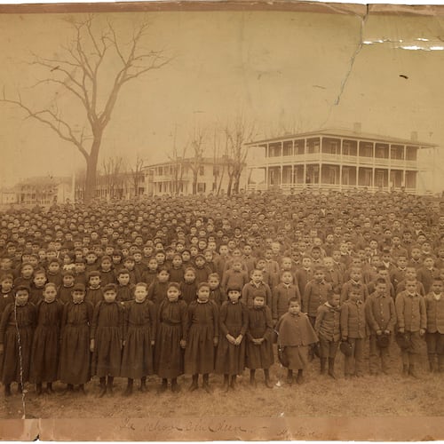 This photo provided by the Carlisle Indian School Digital Resource Center shows the 1892 student body of the Carlisle Indian Industrial School assembled on the school grounds in Carlisle, Pa. (John N. Choate via AP)