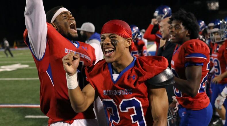 Riverwood wide receivers Austin Simmons (left) and Donovan Logan (23) celebrate after a 21-6 home victory over Carver-Atlanta on Oct. 18, 2019. (Jason Getz/Special)