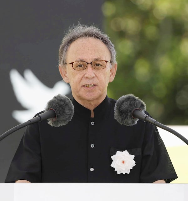 Okinawa Gov. Denny Tamaki reads peace declaration during a memorial ceremony at the Peace Memorial Park in Itoman, Okinawa, southern Japan Monday, June 23, 2025 as Japan marked the 80th anniversary of the end of the Battle of Okinawa. (Haruna Furuhashi/Kyodo News via AP)