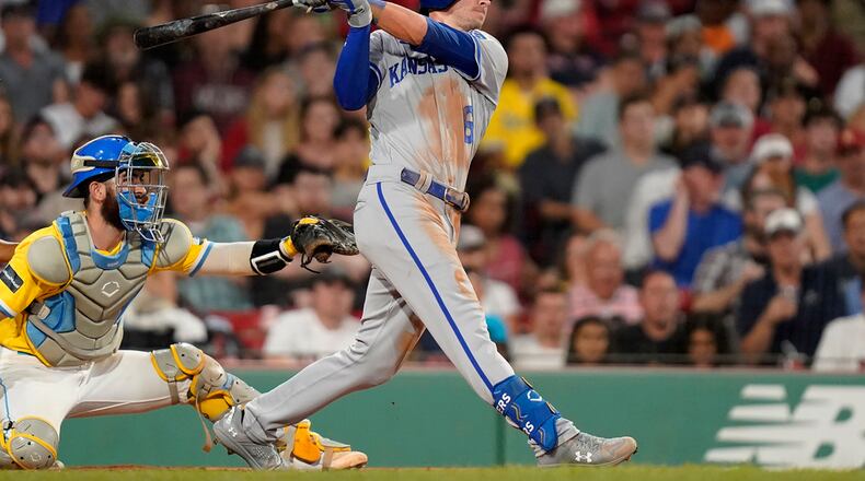 Kansas City Royals' Drew Waters watches his two-run home run next to Boston Red Sox catcher Connor Wong during the fourth inning of a baseball game Tuesday, Aug. 8, 2023, in Boston. (AP Photo/Steven Senne)