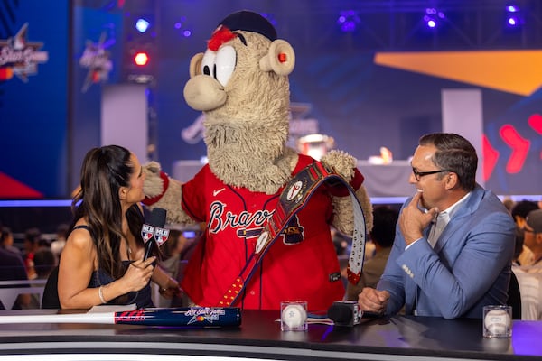 Former Braves player Mark DeRosa (right), who is an analyst with MLB Network, is seen with Braves mascot Blooper before going on air at Coca-Cola Roxy during MLB All-Star Week in Atlanta on Monday, July 14, 2025. (Arvin Temkar/AJC)