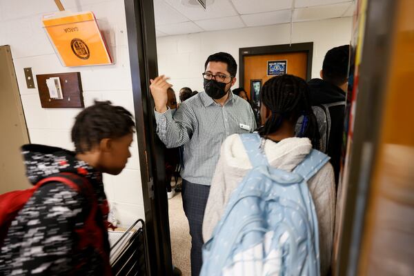 At the end of the class, the social studies teacher at Shiloh Middle School in Gwinnett, Daniel Garcia, helps the students to move to the next class on Tuesday, October 18, 2022. Miguel Martinez / miguel.martinezjimenez@ajc.com