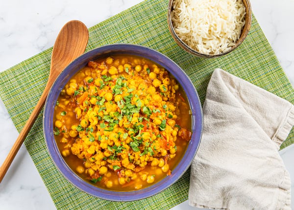 Hearty stews, like this chana masala, come together quickly when you keep beans on hand. (Aaliyah Man for the AJC/food styling by Kate Williams)