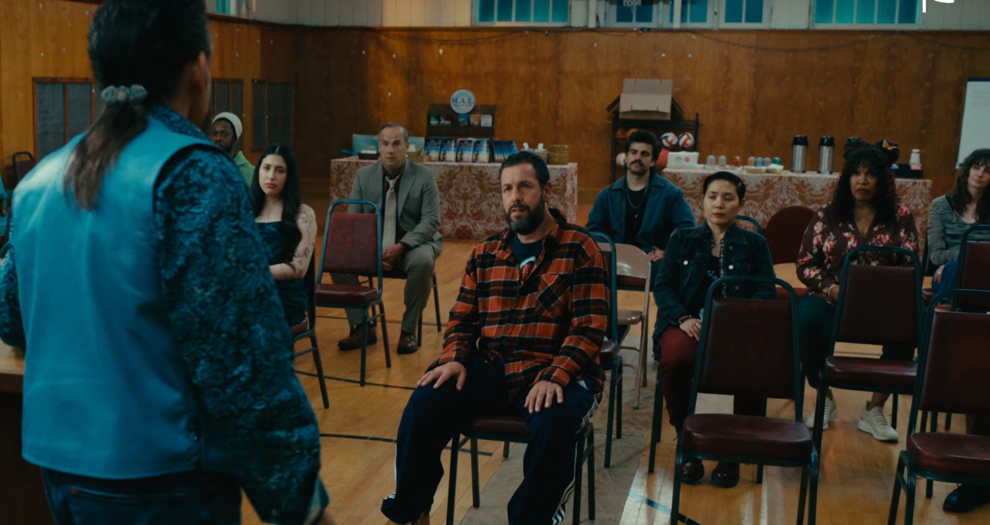 Kym Whitley (in floral top) is in some scenes with Adam Sandler and Ben Stiller in "Happy Gilmore 2." (Netflix)