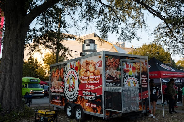 Vendors sell food outside Mercedes-Benz Stadium before the Monday night game between the Buffalo Bills and Atlanta Falcons on Oct. 13, 2025, in Atlanta. Mayor Andre Dickens defended his executive order freezing permits downtown during FIFA activities as a way to prevent permit hoarding, traffic jams or public safety concerns during the international tournament. (Olivia Bowdoin for the AJC)