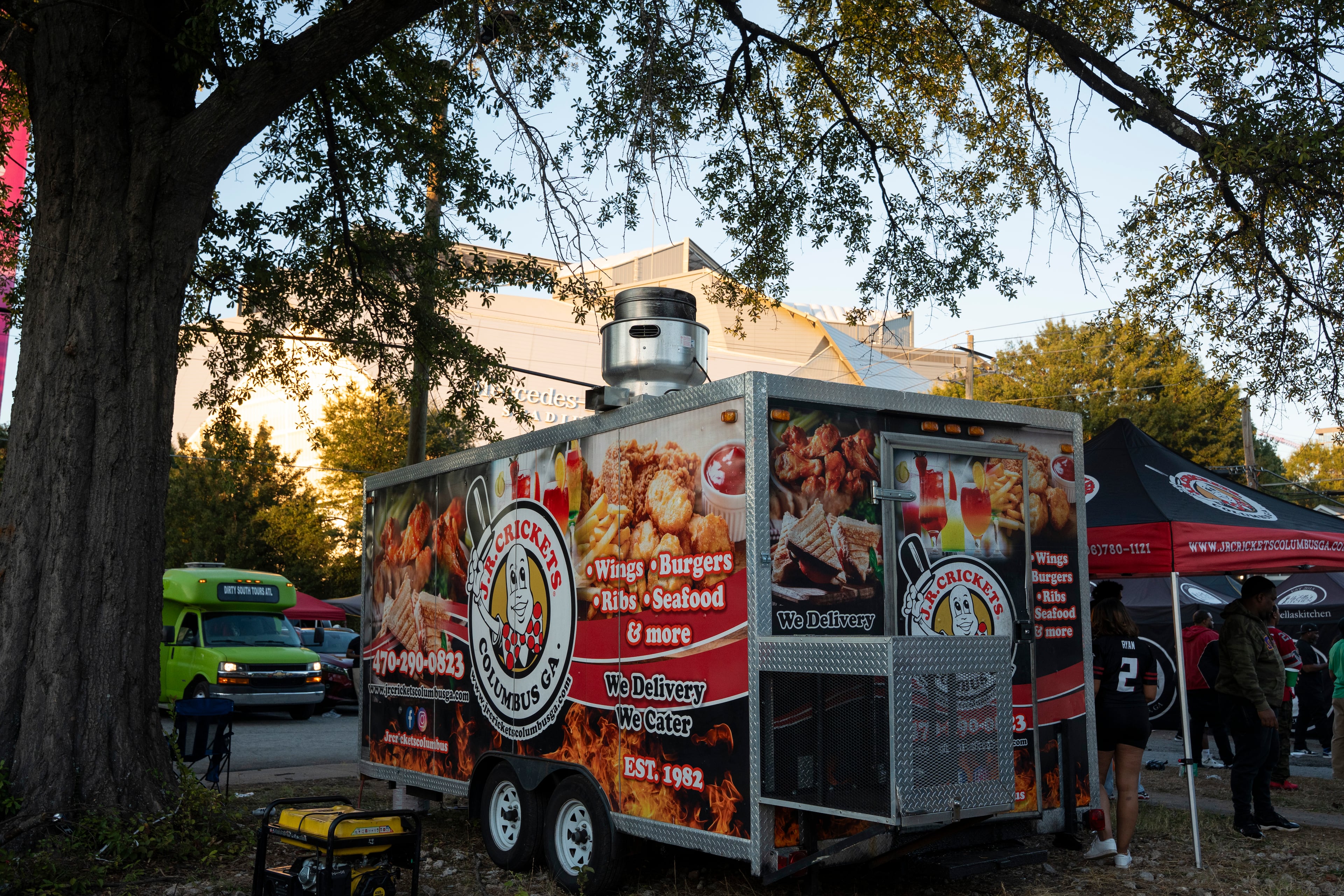 Vendors sell food outside Mercedes-Benz Stadium before the Monday night game between the Buffalo Bills and Atlanta Falcons on Oct. 13, 2025, in Atlanta. Mayor Andre Dickens defended his executive order freezing permits downtown during FIFA activities as a way to prevent permit hoarding, traffic jams or public safety concerns during the international tournament. (Olivia Bowdoin for the AJC)