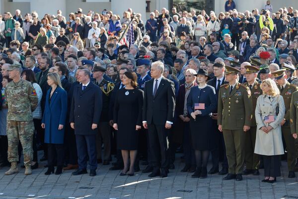 Lithuania's President Gitanas Nauseda, center, U.S. Ambassador to Lithuania Kara C. McDonald, second left, and Speaker of Lithuanian Parliament Saulius Skvernelis, third left, attend a solemn farewell ceremony at Cathedral Square in Vilnius, Lithuania, Thursday, April 3, 2025 for the US soldiers who died during training exercise. (AP Photo/Mindaugas Kulbis)