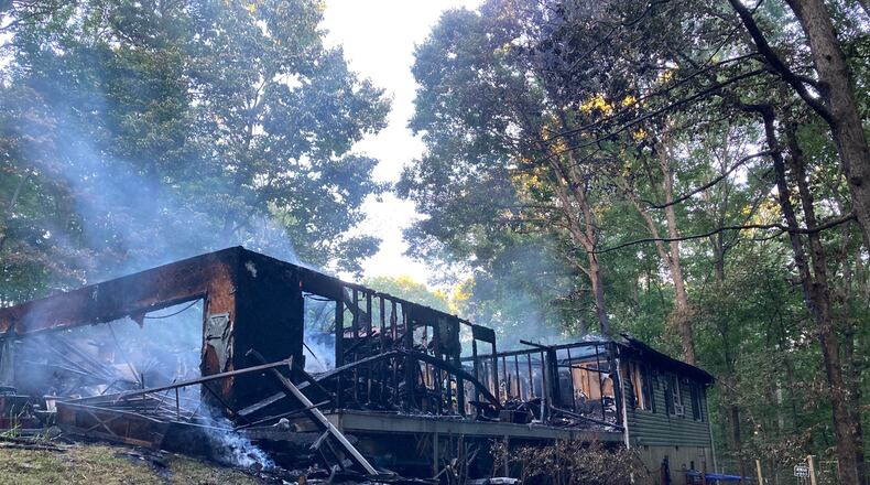 Flames were already shooting into the attic when firefighters arrived at the Hillside Drive home in Paulding County, fire officials said.