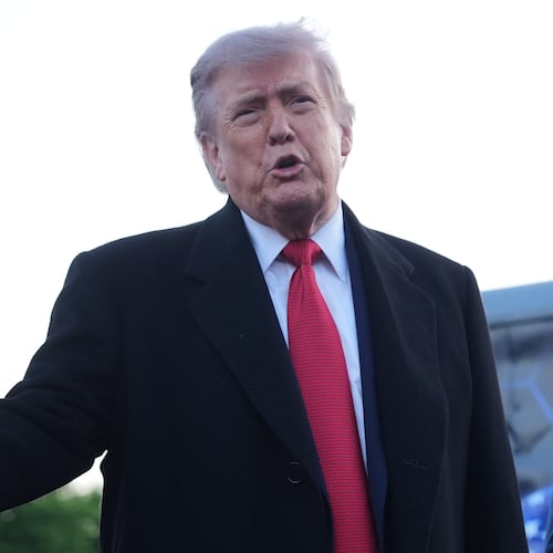 President Donald Trump speaks as he visits the Lincoln Memorial Reflecting Pool to see the new blue protective coating being applied as part of a renovation project, Thursday, May 7, 2026, in Washington. (AP Photo/Mark Schiefelbein)