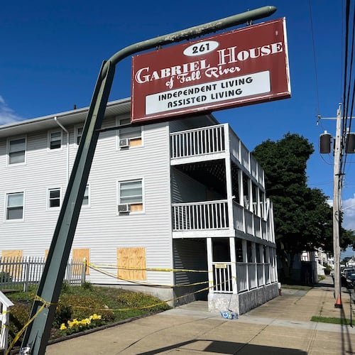 FILE - Boards cover the windows of the Gabriel House assisted living facility, where a fire killed multiple people, July 15, 2025, in Fall River, Mass. (AP Photo/Kimberlee Kruesi, File)