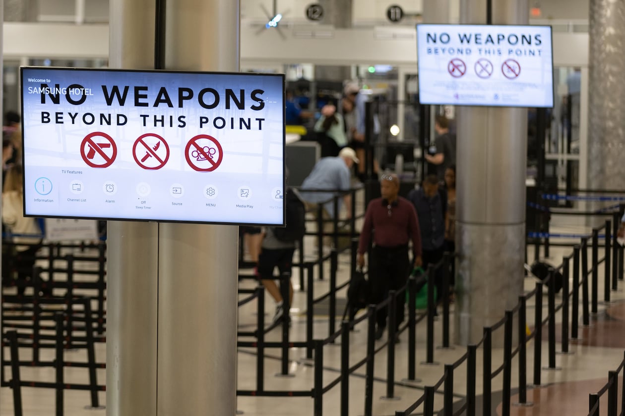 Passengers head through the security checkpoint at Hartsfield-Jackson Atlanta International Airport Friday, July 1, 2022. (Steve Schaefer/AJC)