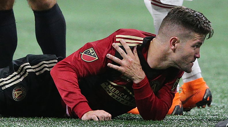 Atlanta United defender Greg Garza goes down with an injury and leaves the game against the New York Red Bulls during the second half Sunday, May 20, 2018, in Atlanta.