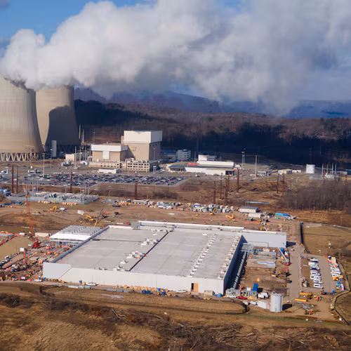 FILE - A data center owned by Amazon Web Services, front right, is under construction next to the Susquehanna nuclear power plant in Berwick, Pa., Jan. 14, 2025. (AP Photo/Ted Shaffrey, File)