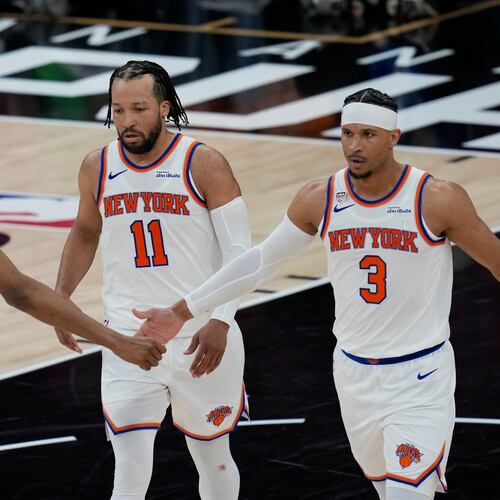 New York Knicks guard Josh Hart (3) greets guard Mikal Bridges (25) during the second half of Game 1 of the NBA Finals basketball series against the San Antonio Spurs, Wednesday, June 3, 2026, in San Antonio. (AP Photo/David J. Phillip)