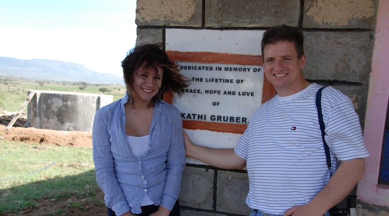 David Gruber, right, with daughter Courtney in front of Kathi s House during a visit to Kenya in April 2008. Courtney, then 14, is the youngest child of Kathi and David Gruber. Contributed