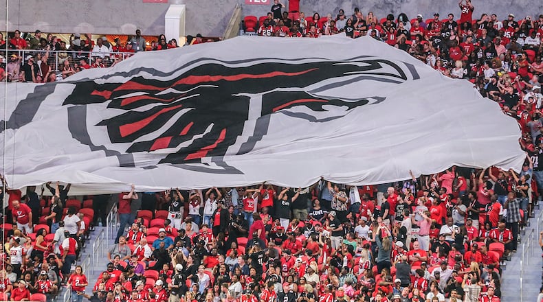 Passing the flag on Saturday, Aug. 26, 2017 at the opening of the brand new Mercedes Benz Stadium and pre-season NFL game between the Atlanta Falcons and the Arizona Cardinals. JOHN SPINK/JSPINK@AJC.COM
