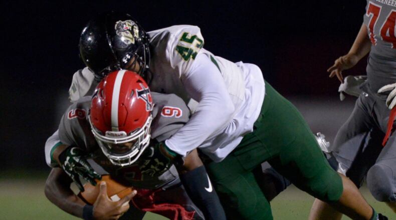 Langston Hughes senior Algie Richardson (45) sacks Allatoona sophomore QB Dante Marshal (9) in the first half of their game at Allatoona High School Friday, November 10, 2017. Special/Daniel Varnado