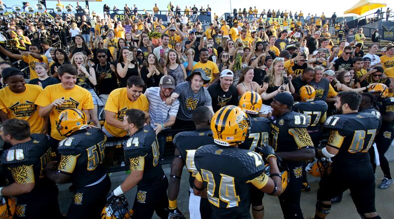 Kennesaw State University football players celebrate with the student section after their inagural win over Edward Waters at Fifth Third Bank Stadium on Sept. 12, 2015. The score of the first home game ever was 58-7.