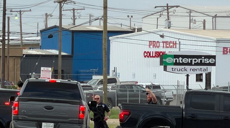 Law enforcement responds to an active shooting scene Friday, June 12, 2026, in Midland, Texas. (Luke Dias/Reporter-Telegram via AP)