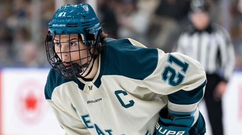 FILE - Seattle Torrent's Hilary Knight (21) waits for a face off against the Vancouver Goldeneyes during the second period of a PWHL hockey game in Vancouver, on Tuesday, April 14, 2026. (Ethan Cairns/The Canadian Press via AP,File)