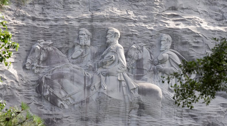 The enormous rock relief on Stone Mountain’s north face, the largest bas-relief in the world, depicts three Confederate figures: Jefferson Davis, Robert E. Lee and Stonewall Jackson.