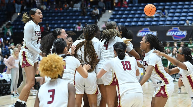 Hebron Christian players celebrate their win over Wesleyan during GHSA Basketball Class 3A Girl’s State Championship game at the Macon Centreplex, Friday, Mar. 8, 2024, in Macon. Hebron Christian won 62-60 over Wesleyan. (Hyosub Shin / Hyosub.Shin@ajc.com)