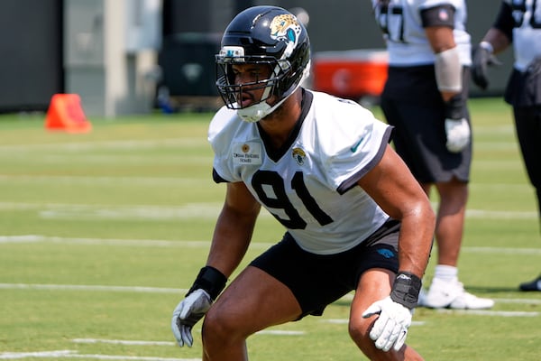 Jacksonville Jaguars defensive end Arik Armstead (91) runs through a drill during a team NFL football practice, Monday, May 19, 2025, in Jacksonville, Fla. (AP Photo/John Raoux)