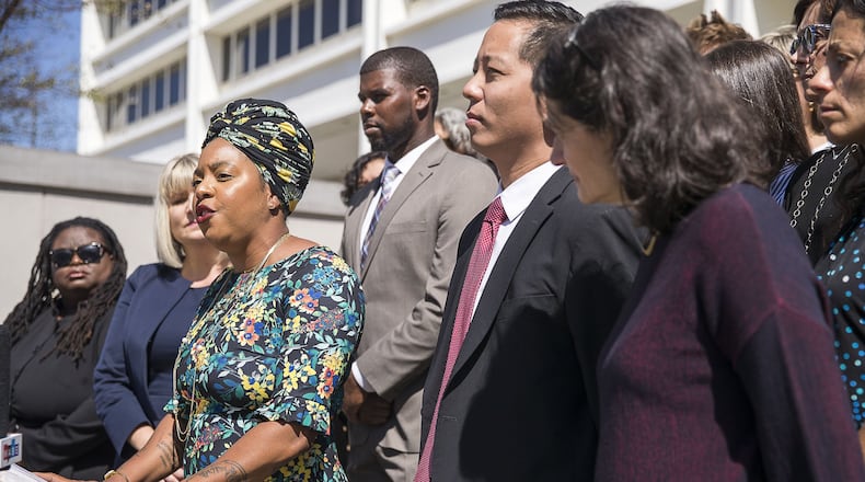Kwajelyn Jackson, third from left, the director of the Feminist Women’s Health Center, speaks during a 2019 press conference about the lawsuit challenging Georgia's restrictive anti-abortion law. (Alyssa Pointer/alyssa.pointer@ajc.com)