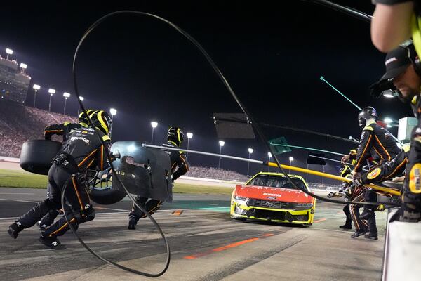 The pit crew for Ryan Blaney rushes to work on the car during a NASCAR Cup Series auto race Sunday, June 1, 2025, in Lebanon, Tenn. (AP Photo/George Walker IV)