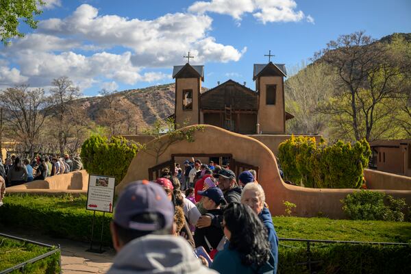 Thousands of pilgrims make their way to El Santuario De Chimayo in Northern New Mexico on Good Friday, April 18, 2025 in Chimayo, N.M. (AP Photo/Roberto E. Rosales)