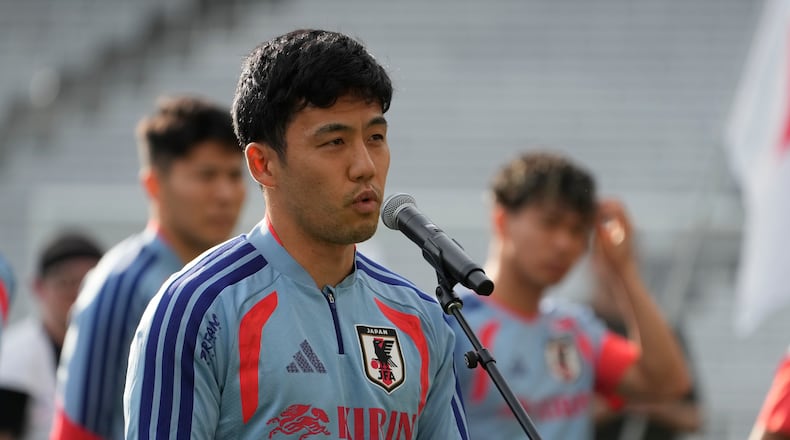 Japan's Wataru Endo addresses fans before a training session Monday, June 8, 2026, in Nashville, Tenn., ahead of the World Cup soccer tournament. (AP Photo/George Walker IV)