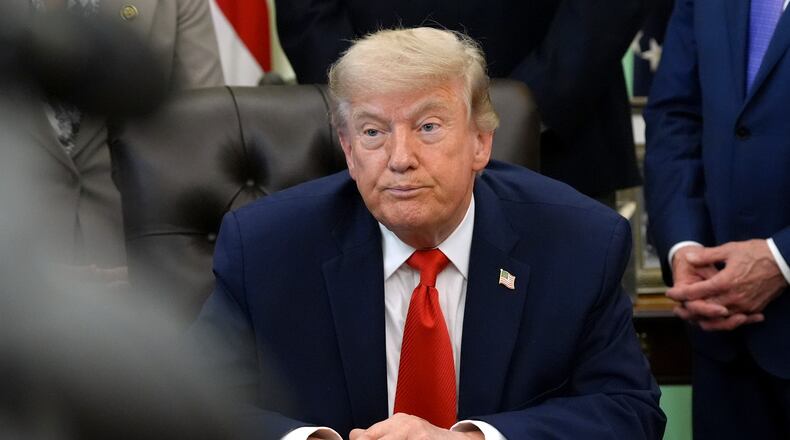 President Donald Trump listens during an event to sign a proclamation about the fishing industry, in the Oval Office of the White House, Thursday, June 11, 2026, in Washington. (AP Photo/Jacquelyn Martin)