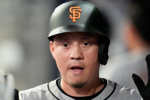 San Francisco Giants' Wilmer Flores (41) celebrates after hitting a three-run home run against the Atlanta Braves inning of a baseball game, Tuesday, July 22, 2025, in Atlanta. (AP Photo/Mike Stewart)