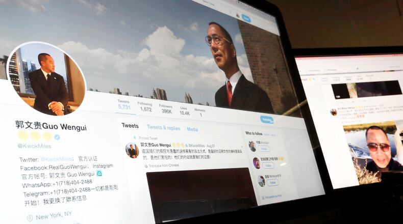 FILE - A Twitter page of Chinese exiled businessman Guo Wengui is seen on a computer screen in Beijing, Aug. 30, 2017. (AP Photo/Andy Wong, File)