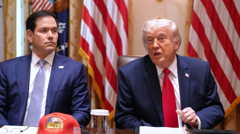 President Donald Trump, next to Secretary of State Marco Rubio, speaks during a Cabinet meeting at the White House, Wednesday, May 27, 2026, in Washington. (AP Photo/Jacquelyn Martin)