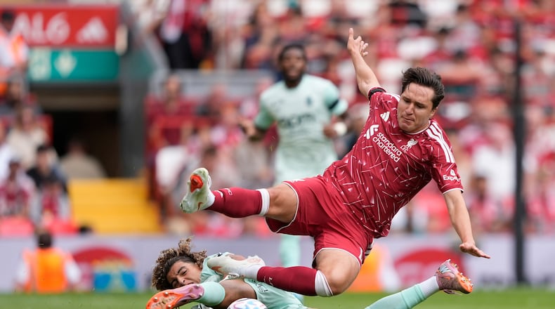 Monaco's Anis Soubeir and Liverpool's Federico Chiesa, right, in action during the pre-season friendly soccer match between Liverpool and AS Monaco in Liverpool, England, Sunday Aug. 9, 2026. (Peter Byrne/PA via AP)