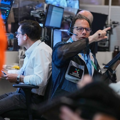 Optons trader Anthony Spina, center, works on the floor of the New York Stock Exchange, Monday, June 15, 2026. (AP Photo/Richard Drew)