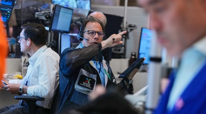 Optons trader Anthony Spina, center, works on the floor of the New York Stock Exchange, Monday, June 15, 2026. (AP Photo/Richard Drew)