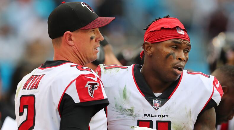 Falcons wide receiver Julio Jones and quarterback Matt Ryan react on the sidelines after Jones dropped a certain touchdown pass in the end zone during the fourth quarter against the Panthers in a NFL football game on Sunday, November 5, 2017, in Charlotte. The Panthers held on to beat the Falcons 20-17.   Curtis Compton/ccompton@ajc.com