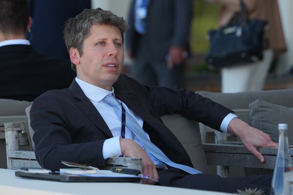 CEO of OpenAI Sam Altman — pictured at the G7 summit in June —  called for domestic and international regulation of AI development in congressional testimony in 2023, but three years later the company has been criticized for creating an “AI arms race” and other existential threats through rapid deployment of competing algorithms. (Julia Demaree Nikhinson/AP)