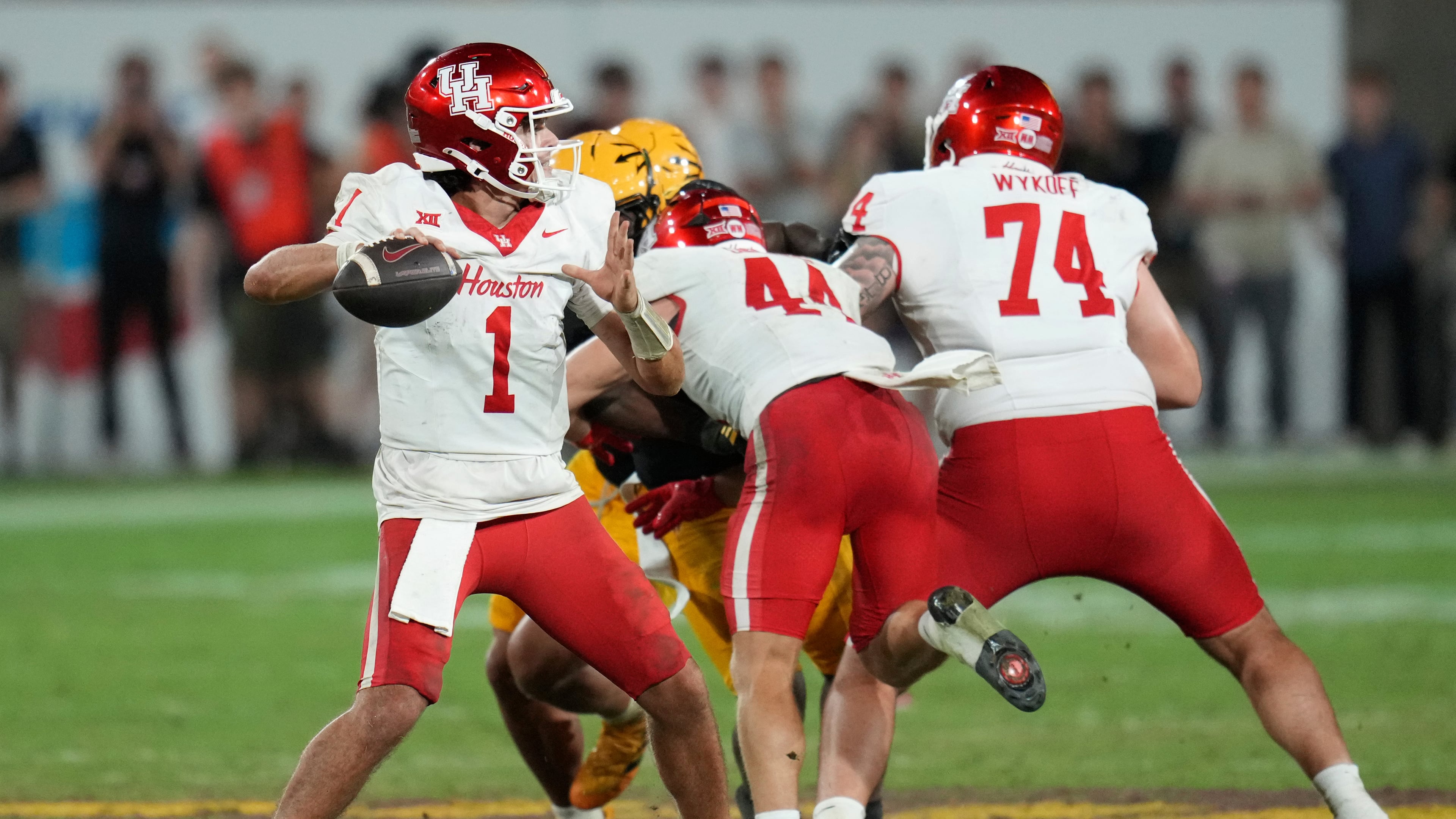 Houston quarterback Conner Weigman (1) throws against Arizona State during the second half of an NCAA college football game Saturday, Oct. 25, 2025, in Tempe, Ariz. (AP Photo/Ross D. Franklin)