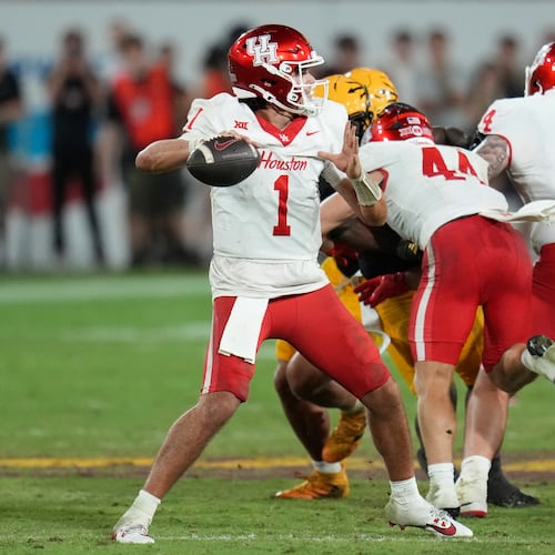 Houston quarterback Conner Weigman (1) throws against Arizona State during the second half of an NCAA college football game Saturday, Oct. 25, 2025, in Tempe, Ariz. (AP Photo/Ross D. Franklin)