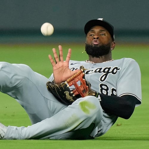 FILE -Chicago White Sox center fielder Luis Robert Jr. catches a fly ball for the out on Kansas City Royals' Mike Yastrzemski during the seventh inning of a baseball game, Aug. 15, 2025, in Kansas City, Mo. (AP Photo/Charlie Riedel), File)