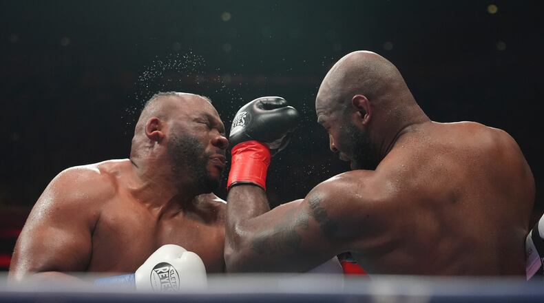 Kingsley Ibeh, right, punches Jarrell Miller during a heavyweight boxing match Saturday, Jan. 31, 2026, in New York. (AP Photo/Frank Franklin II)