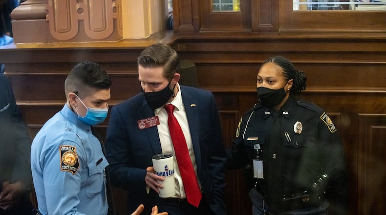 Georgia State Representative David Clark is removed from the state house chamber by Georgia State Trooper Justice after refusing to take Covid-19 tests in Atlanta, Georgia on January 26th. MANDATORY CREDIT: NATHAN POSNER