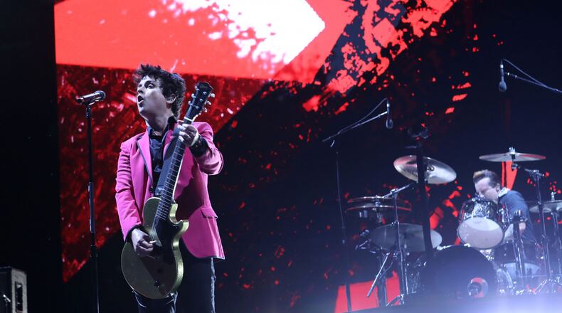 Green Day, Fall Out Boy and Weezer rocked out Truist Park on Tuesday, July 27, 2021 on the Hella Mega Tour.
An estimated 40,000 concert fans celebrated the return of live music and even early rains could not dampen the festive atmosphere at the Braves stadium.
Robb Cohen for the Atlanta Journal-Constitution