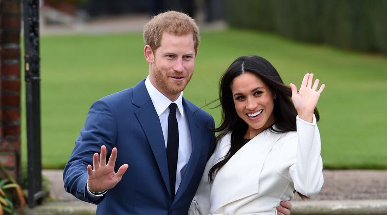 Newly engaged Prince Harry and Meghan Markle pose during a photo shoot at Kensington Palace. ASSOCIATED PRESS