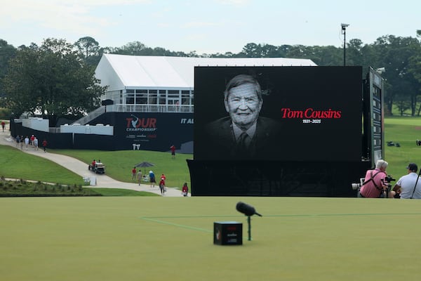 A moment of silence is observed in memory of Atlanta businessman and developer Tom Cousins before the start of the first round of the PGA Tour Championship at East Lake Golf Club, Thursday, Aug. 21, 2025, in Atlanta. (Jason Getz/AJC)