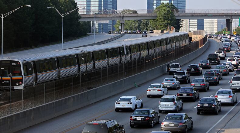 A MARTA train makes its way North past Ga. 400 traffic.